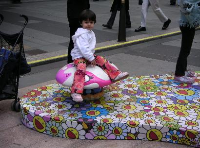 child sitting on mushroom